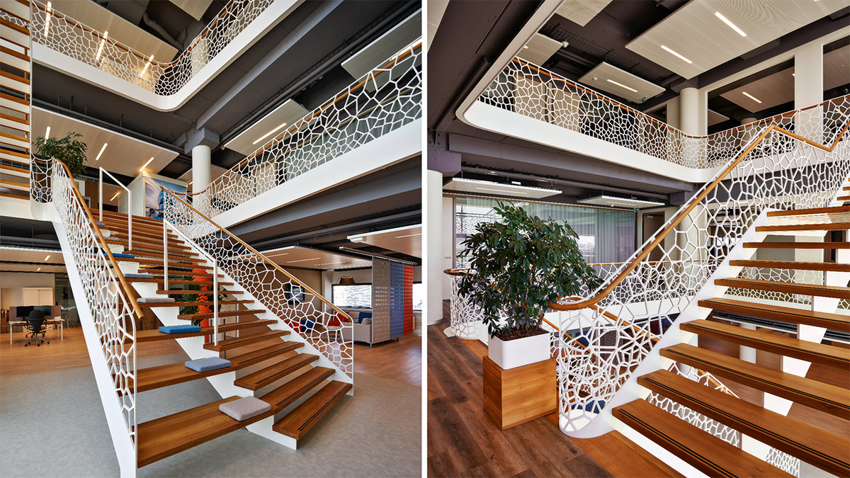 Treppenaufgang am Amsterdamer Flughafen mit Designgeländer mit Sitzgelegenheit von EeStairs DE
